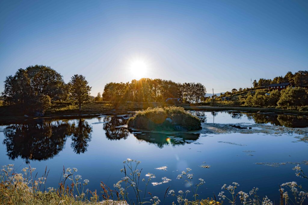 Sun setting over a lake